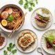 jalbiteblog trend food — vibrant flat-lay of viral 2025 food items including chili oil ramen, matcha dessert, mini plates, and fusion street food on a clean white surface